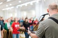 Man guitar player on acoustic playing guitar at concert Royalty Free Stock Photo