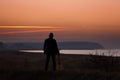 Man with guitar in sunset Royalty Free Stock Photo