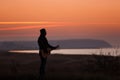 Man with guitar in sunset Royalty Free Stock Photo