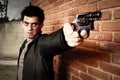Man with gun in an alley Royalty Free Stock Photo