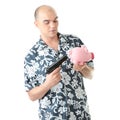 Man with gun pointing at piggy bank Royalty Free Stock Photo