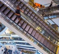 Man guy people rushing step in motion on escalator in the mall building