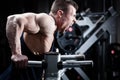 Man in gym at dip exercise