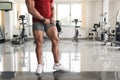 Man in Gym Showing His Well Trained Legs