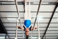 Man, gymnast and upside down on poles in fitness for practice, training or workout at gym. Professional male acrobat in