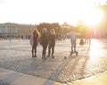 The man on Gyroscooter. People on Gyroscooter rides at sunset on the Palace square, among the tourists in Saint-Petersburg. Russia