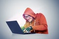 Man Hacker in glasses with a laptop. Cybercrime concept