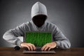 Man Hacking Laptop At Desk Royalty Free Stock Photo