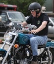 Man with hair flying on a motorcycle