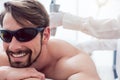 Man in a hair removal studio Royalty Free Stock Photo