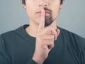 Man with half beard and finger on lips Royalty Free Stock Photo