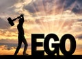 Man with a hammer in his hand intends to destroy the word ego Royalty Free Stock Photo