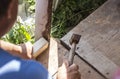 Man hammering a nail in the floor Royalty Free Stock Photo