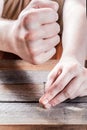 Man Hammering A Nail With His Clenched Fist In A Piece Of Wood - Man Power Concept Royalty Free Stock Photo