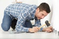 Man hammers nail with hammer Royalty Free Stock Photo