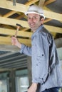 man hammers nail with hammer Royalty Free Stock Photo