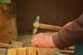 A man hammers nails with a hammer Royalty Free Stock Photo