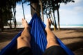 Man in Hammock Faces Beach with Happy Feet Royalty Free Stock Photo