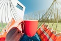 man in hammock holding a cup Royalty Free Stock Photo