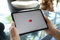 Man hand Apple iPad Air Space Gray App YouTube Google