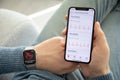 Man hand Apple Watch and iPhone with ECG app scree