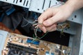 Man hand assembles computer cable Royalty Free Stock Photo