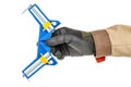 Man hand in black protective glove and brown uniform with blue and yellow angle clamp isolated on white background