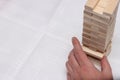 Man hand building wood block tower. Jenga Game Royalty Free Stock Photo