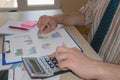 Man hand with calculator at workplace office. A businessman doing some paperwork using his calculator Royalty Free Stock Photo