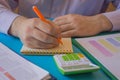 Man hand with calculator at workplace office. A businessman doing some paperwork using his calculator Royalty Free Stock Photo