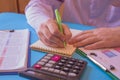 Man hand with calculator at workplace office. A businessman doing some paperwork using his calculator Royalty Free Stock Photo