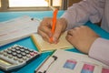 Man hand with calculator at workplace office. A businessman doing some paperwork using his calculator Royalty Free Stock Photo