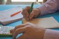 Man hand with calculator at workplace office. A businessman doing some paperwork using his calculator Royalty Free Stock Photo