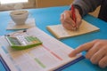 Man hand with calculator at workplace office. A businessman doing some paperwork using his calculator Royalty Free Stock Photo