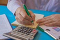 Man hand with calculator at workplace office. A businessman doing some paperwork using his calculator Royalty Free Stock Photo