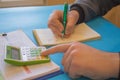 Man hand with calculator at workplace office. A businessman doing some paperwork using his calculator Royalty Free Stock Photo