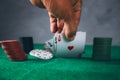 Man hand cards playing poker