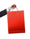 Man hand carrying and showing a Red Shopping Bag