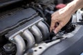 Man hand checking level of coolant car engine. Service and maintenance car or vehicle