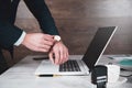 man hand clock on computer keyboard background. Royalty Free Stock Photo