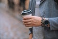man hand close up holding disposable coffee cup Royalty Free Stock Photo