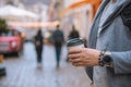 man hand close up holding disposable coffee cup Royalty Free Stock Photo