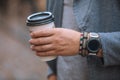 man hand close up holding disposable coffee cup Royalty Free Stock Photo