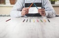 Man hand color pencils