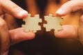 Man hand connecting jigsaw puzzle, Business solutions,Team work, success and strategy concept