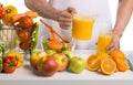 Man hand cook cooking cfreshly squeezed juice on kitchen