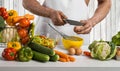 Man hand cook make omelette, beating whisk eggs, on kitchen