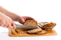 Man hand cutting bread isolated on white background healthy food Royalty Free Stock Photo