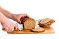 Man hand cutting bread isolated on white background Royalty Free Stock Photo