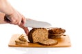 Man hand cutting bread isolated on white background Royalty Free Stock Photo